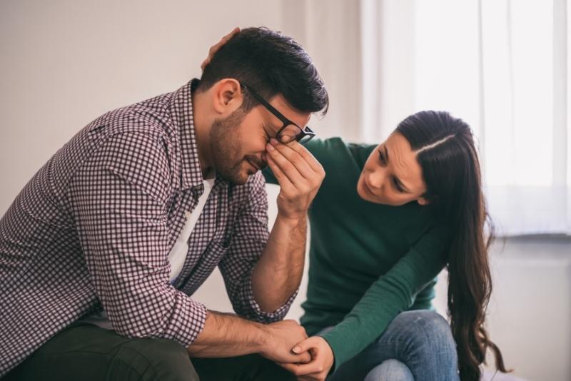 image showing a depressed man with woman