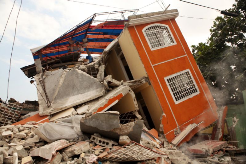 photograph of a damaged building after earthquake in himalayan region