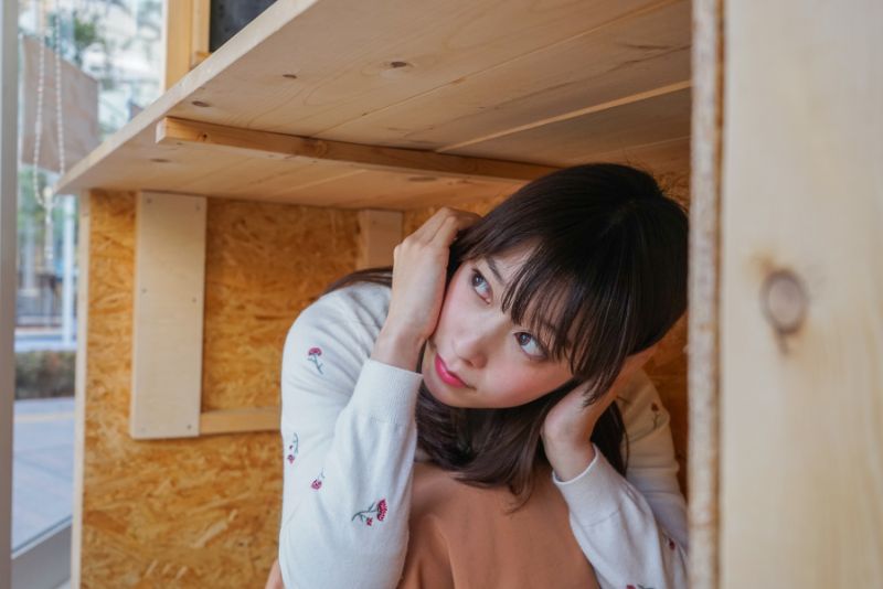 An image of a girl under table earthquake in himalayan region, earthquake preparedness