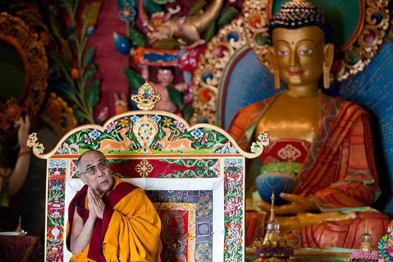 Dalai Lama addressing a crowd during a spiritual discourse