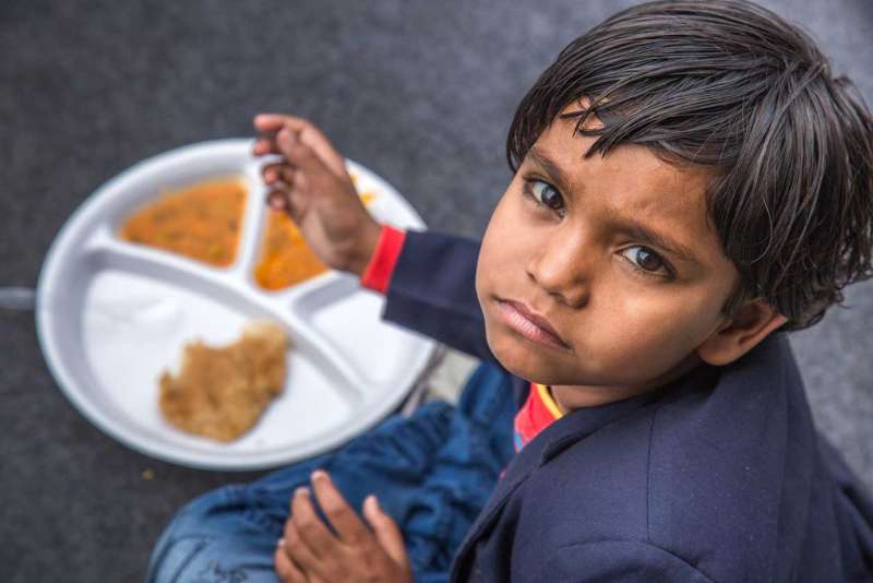 child with his meal poshan tracker app