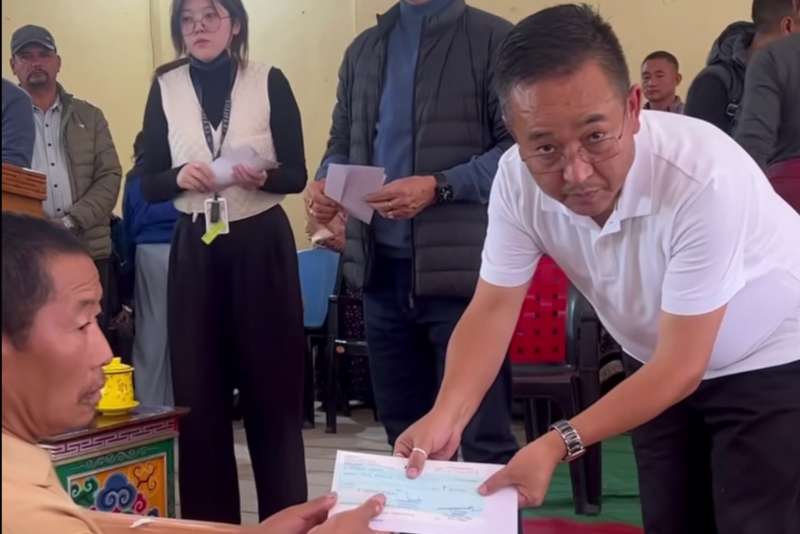 Chief Minister Golay distributing relief funds in Chungthang.
