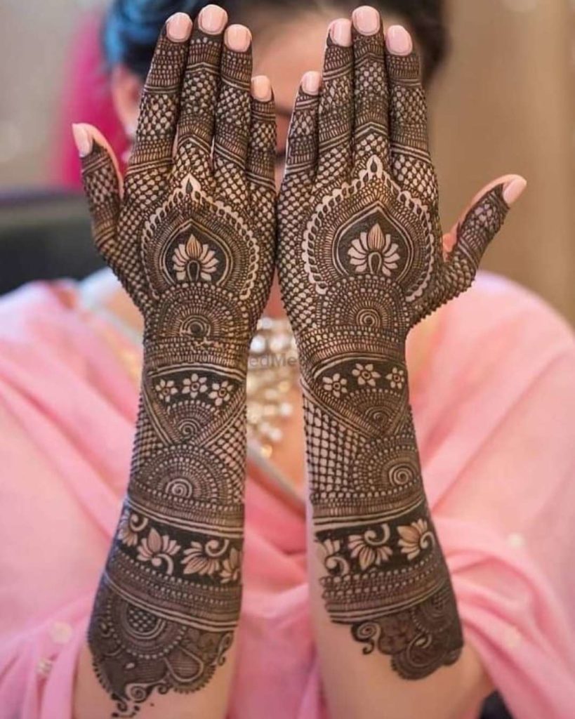 detailed storytelling through intricate back hand mehndi